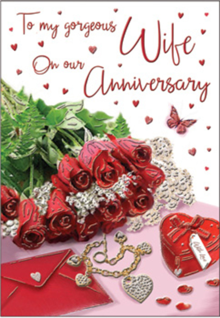 In this richly romantic anniversary card design, the scene unfolds like a cherished memory laid out on a polished tabletop in an Ilford sitting room, washed in soft, natural daylight. At centre stage lies a bouquet of classic red roses, each bloom luxuriously full and perfectly shaped, their deep ruby petals layered in tight spirals that invite the imagination to trace every curve. The roses are wrapped with care, accompanied by lush green foliage that adds both structure and a sense of natural abundance, reminiscent of fresh stems carried home from a florist near Ilford Lane. Surrounding the bouquet are gentle, intricate details: a whisper-thin lace accent that introduces a touch of vintage charm, delicate heart motifs that seem to float across the surface, and a scattering of trinkets that hint at years of loving gestures. A refined jewellery set glints beside a vivid red box, its smooth exterior catching the light like satin, suggesting a surprise hidden within-perhaps a ring or pendant to mark another milestone together. The envelope nearby rests partially tucked under the flowers, its pristine surface promising thoughtful words penned by hand. Soft highlights glimmer off touches of gold and silver, while the surrounding textures-velvet, silk, and polished metal-create a rich sensory tapestry. The entire arrangement feels intentional and personal, a quiet echo of dinners at home or walks through Valentines Park after a delivery has arrived. The mood is undeniably romantic and reassuring, a visual embrace that honours the depth and warmth of a long-lasting partnership in the heart of Ilford.
